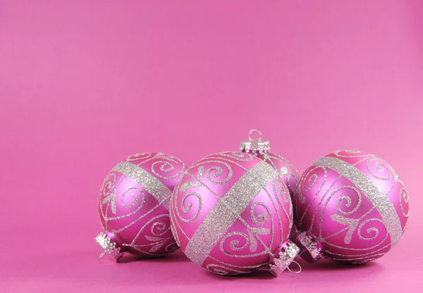 Beautiful fuchsia pink Merry Christmas bauble ornaments with copy space. — Stock Photo, Image