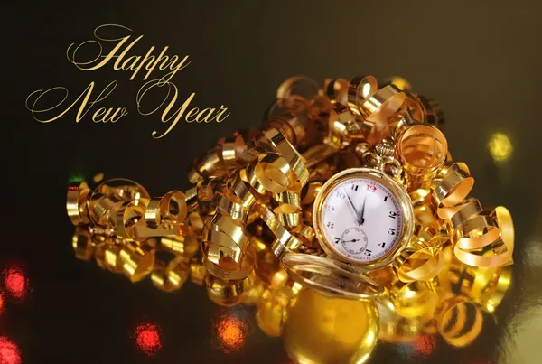 Gold pocket fob watch ready for midnight on New Years Eve — Stock Photo, Image