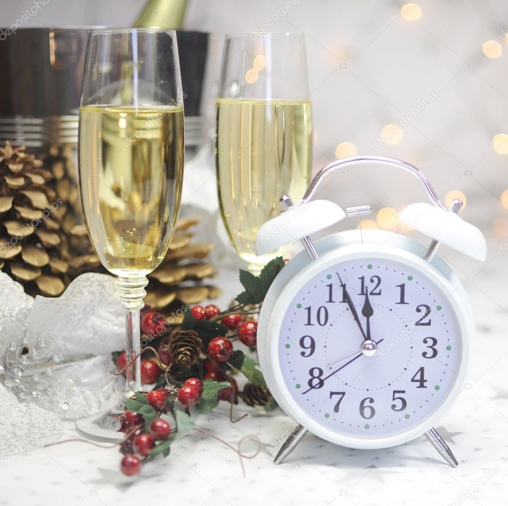 Happy New Year table with retro white clock and champagne