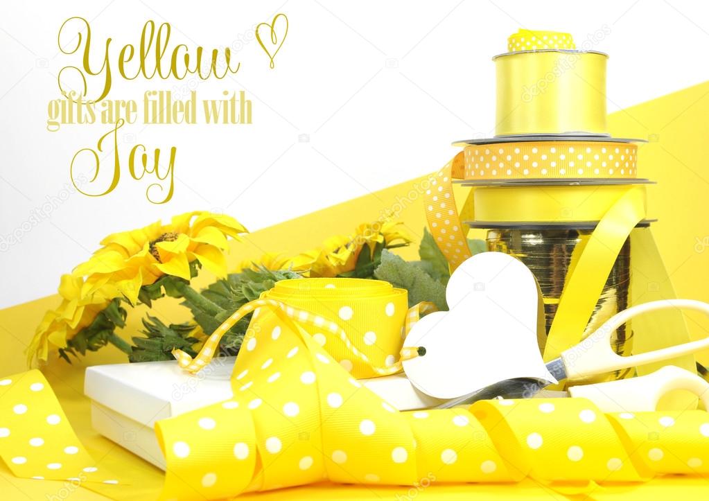 Bright color yellow theme gift box and ribbons & wrapping. — Stock Photo © amarosy 40495005