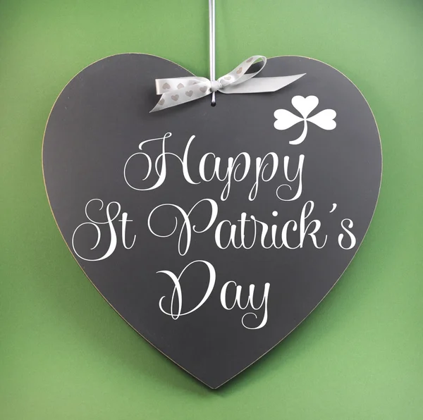 Happy St Patricks Day greeting on heart shape blackboard — Stock Photo, Image