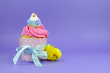 Happy Easter pink, yellow and blue cupcake fairy cakes. clipart