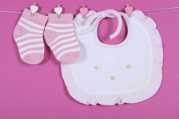 Baby girl nursery cute pink and white stripe socks and bib hangi — Stock Photo, Image