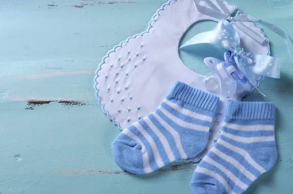 Baby boy nursery blue and white socks, bib and dummy pacifier, w — Stock Photo, Image