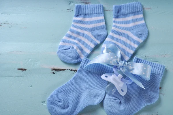Baby boy nursery blue and white socks and dummy pacifier, with c — Stock Photo, Image