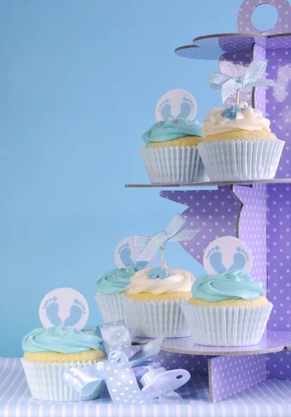 Blue theme baby boy cupcakes on purple polka dot cupcake stand — Stock Photo, Image