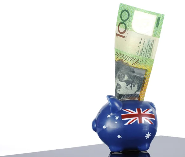 Australian one hundred dollar note in piggy bank — Stock Photo, Image