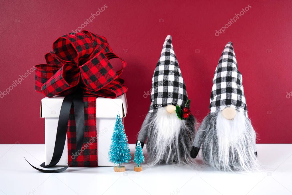 Christmas farmhouse black red and white plaid check gnomes and gift.