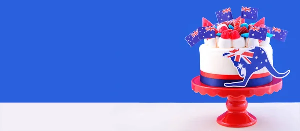 Australian theme cake with flags, kangaroo, and candy decorations banner. — ストック写真