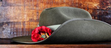 Australian army slouch hat with red poppy for Anzac Day or Remembrance Day. clipart