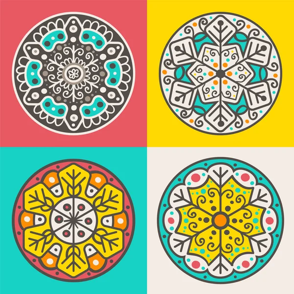 Набор из четырех декоративных круглых элементов — стоковый вектор