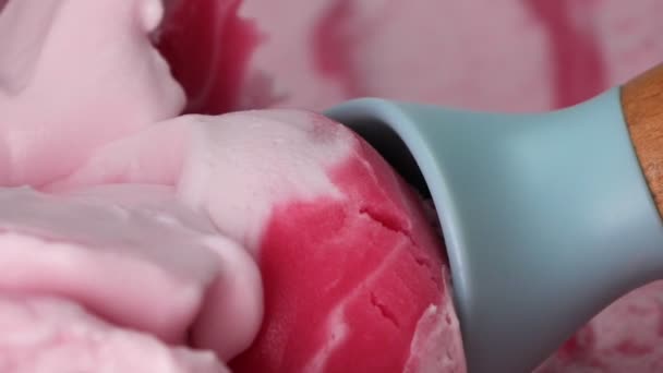 Close Ice Cream Scooped Blue Spoon Strawberry Flavored Pink Meat — Stockvideo