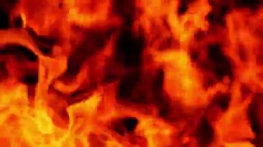 Yakından, turuncu alev yanıyordu. Ateşin gücü hareket ediyordu ve yanıyordu..
