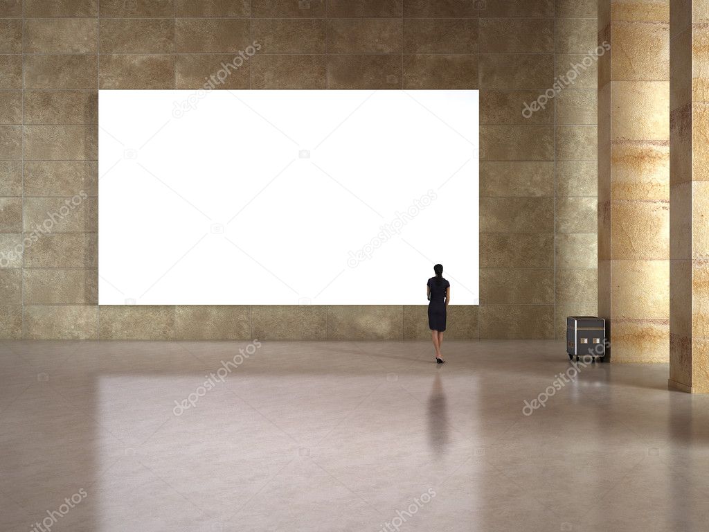 Woman look at the blank frame in art gallery