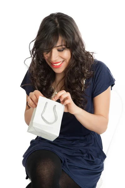 Woman opens a gift — Stock Photo, Image