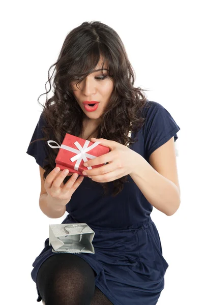 Woman opens a gift — Stock Photo, Image