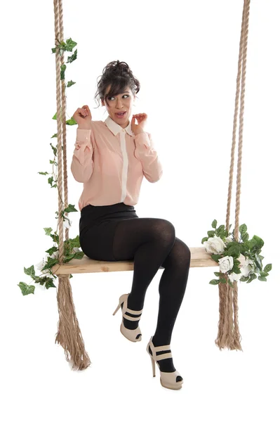 Beautiful woman on a swing — Stock Photo, Image