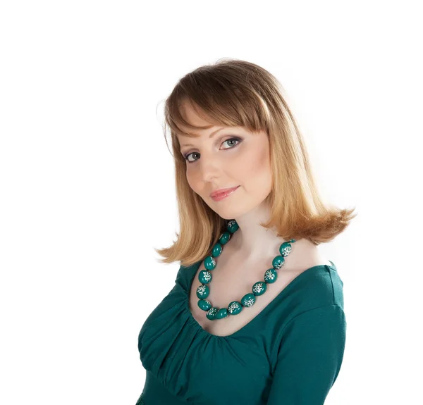 Schoonheid portret van een blonde in een groene jurk — Stockfoto
