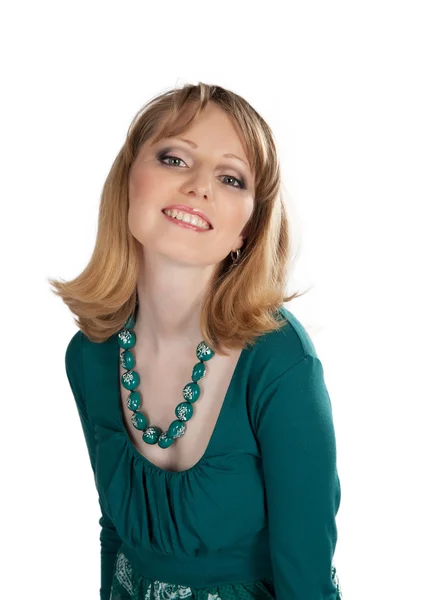 Beauty portrait of a blonde in a green dress — Stock Photo, Image