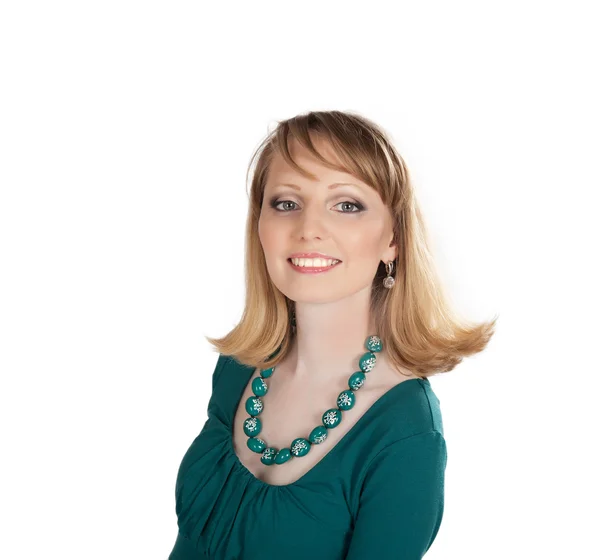 Beauty portrait of a blonde in a green dress — Stock Photo, Image