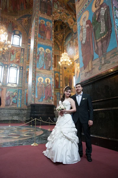 Bride and groom in the church museum — Stock Photo, Image