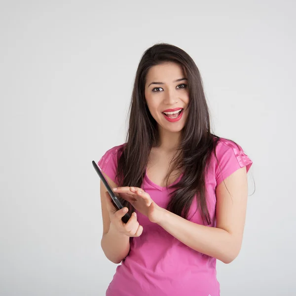 Beautiful woman is pleased tablet — Stock Photo, Image