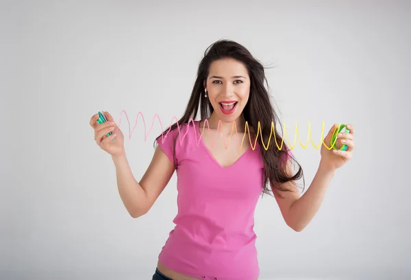 Woman with a toy rainbow — Stock Photo, Image