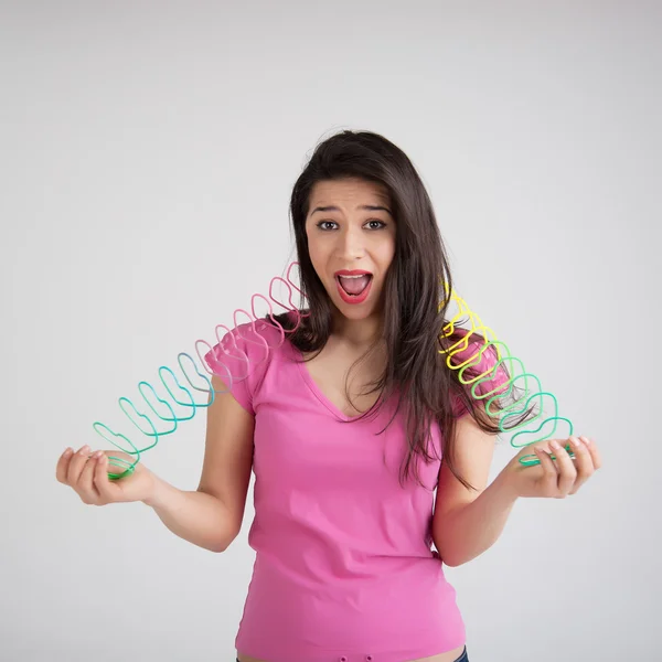 Woman with a toy rainbow — Stock Photo, Image