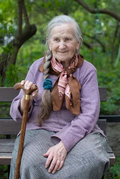 Old grandmother with a long braid — Stock Photo, Image