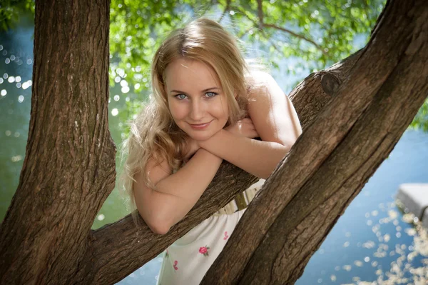 Beautiful woman on a background of foliage — Stock Photo, Image