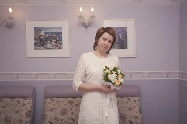 Bride in a white dress — Stock Photo, Image