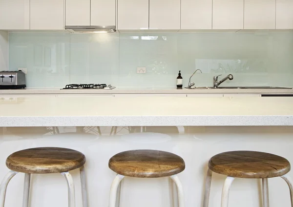 Kitchen splashback bench and stools — Stock Photo, Image