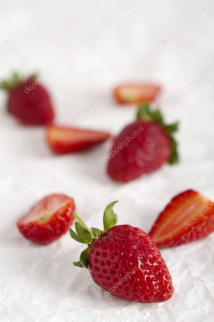 Strawberries on contemporary white sparse background