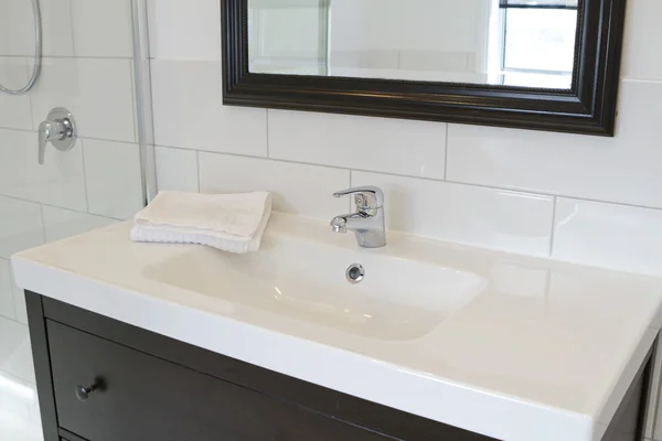 Black bathroom vanity and mirror — Stock Photo, Image