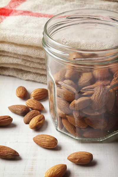 Mason Jar of almonds with hessian in background