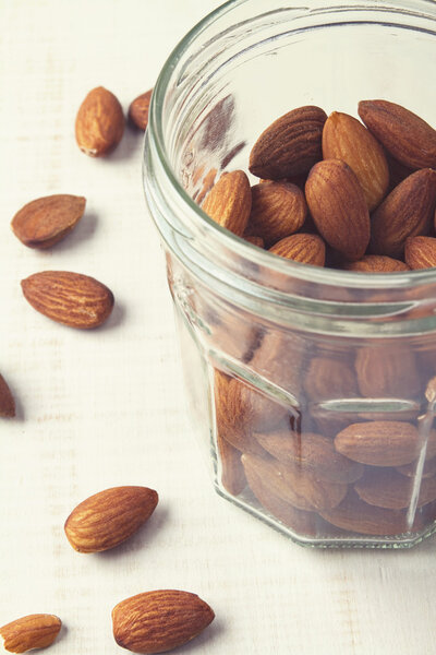 Healthy almonds in around a mason jar