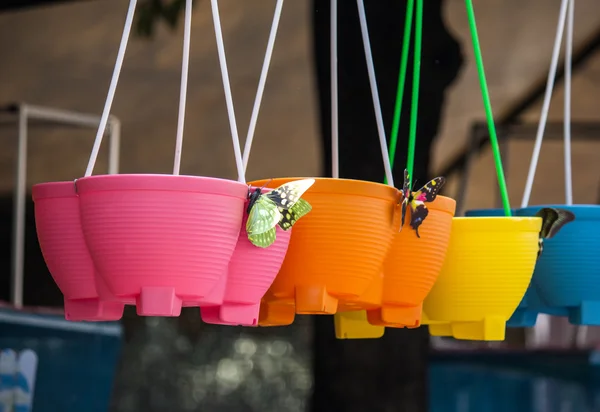 Colourful plastic flower pots — Stock Photo, Image