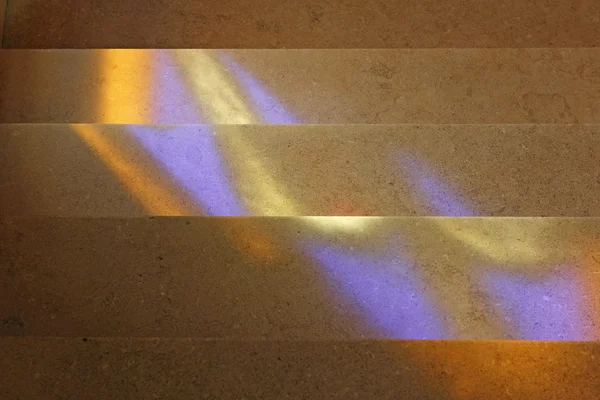Stained glass reflections on stairs — Stock Photo, Image