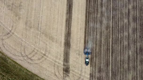 Tractor Harrows Wheat Field Very Dry Summer Season Aerial View — Vídeos de Stock