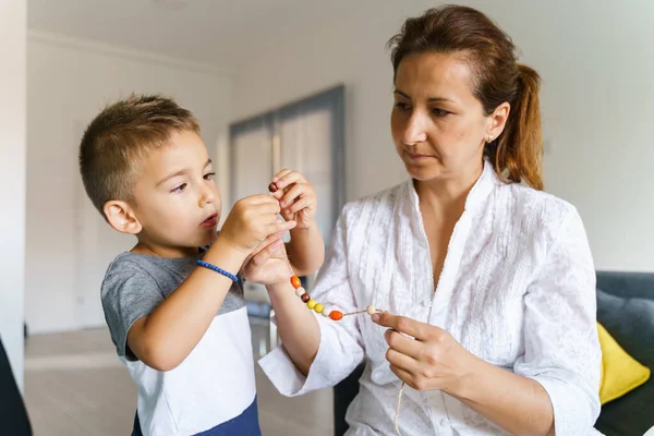 Front View Small Caucasian Boy Years Old Making Bracelet His — Stock Photo, Image