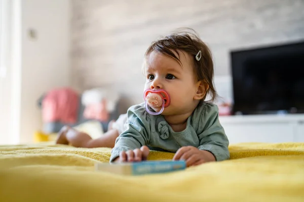 Front View Happy Small Caucasian Baby Lying Bed Playing Book — Stock Photo, Image