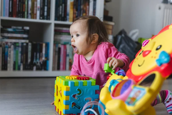 One Small Caucasian Baby Girl Ten Months Old Playing Alone — Stock Photo, Image