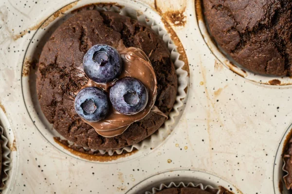 Fresh Baked Muffins Chocolate Cream Blueberries Ceramic Pan Top View — 스톡 사진