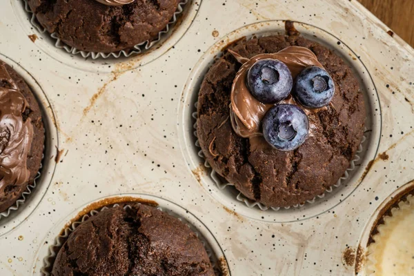 Fresh Baked Muffins Chocolate Cream Blueberries Ceramic Pan Top View — 스톡 사진