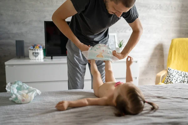 Father Changing Diapers His Daughter Toddler Girl Home Bedroom Early — Stock Photo, Image