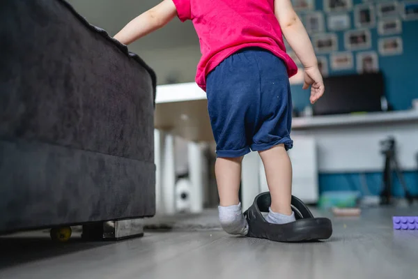 One Caucasian Toddler Girl Child Playing Slippers Home Room Alone — Stock Photo, Image