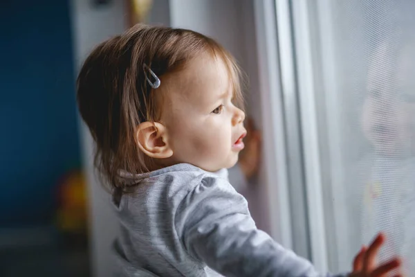 One Small Caucasian Baby Girl Standing Window Home Looking Alone — Stock Photo, Image