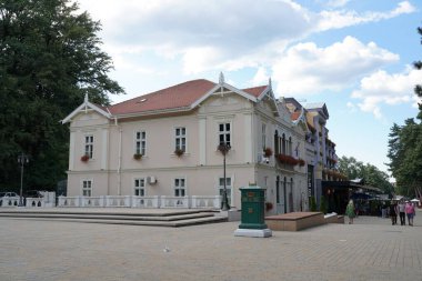 Vrnjacka Banja, Serbia - 08. 03. 2022: Street promenade with tourists in sunny summer day - Vrnjacka Banja spa is a popular tourist destination in Serbia