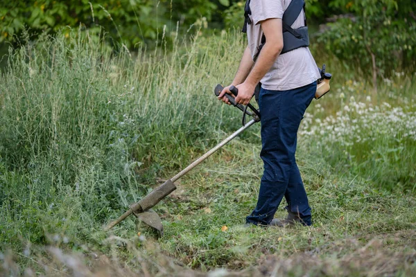 Young Caucasian Man Farmer Gardener Standing Field String Trimmer Petrol — Stockfoto