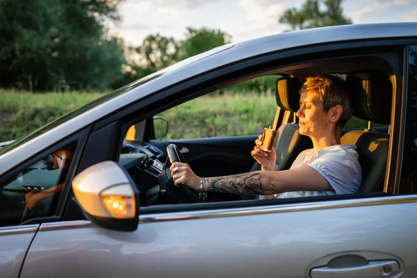 One Woman Mature Caucasian Female Tattoo Arms Hold Flask While — 스톡 사진